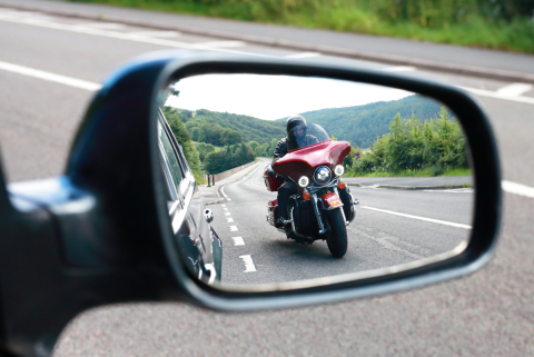 Motorcycle in car mirror